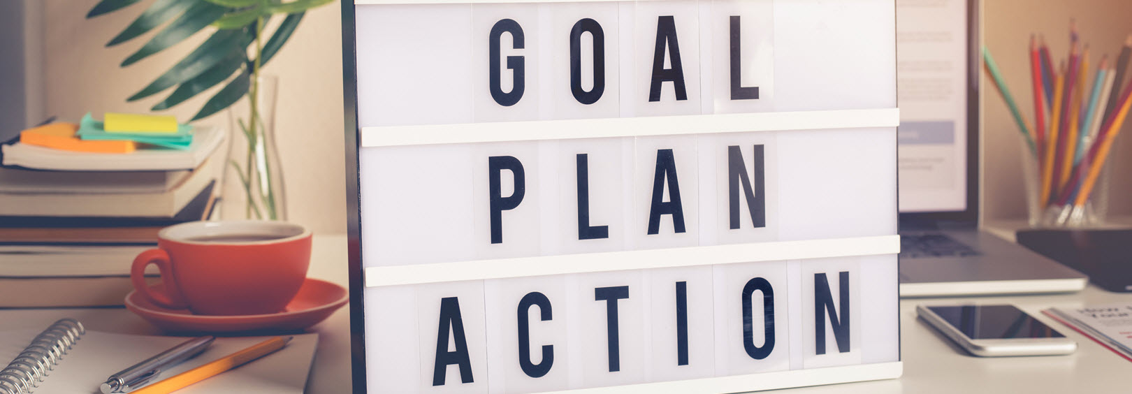sign displaying the words goal plan and action
